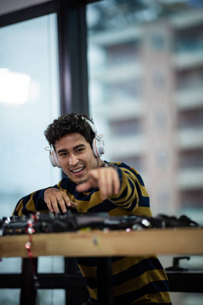 istock DJ working with Digital Mixer & Controller in celebration party 1187280438