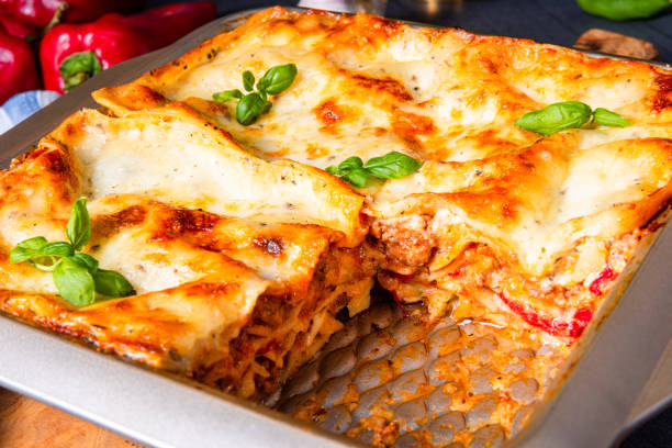 istock rustic spicy lasagne with basil on the tin. 1187281944