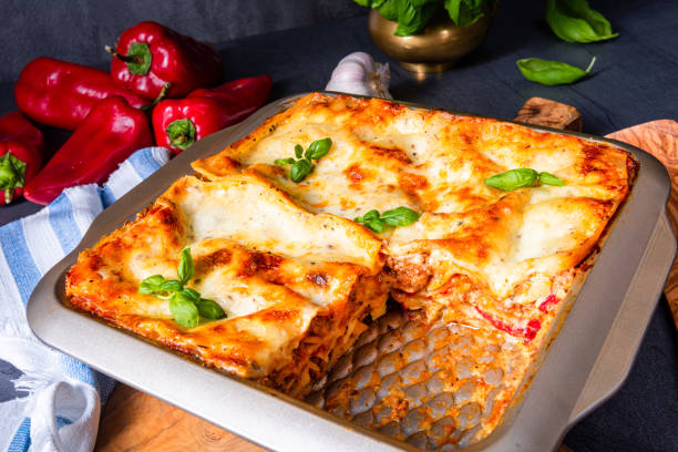 istock rustic spicy lasagne with basil on the tin. 1187281958