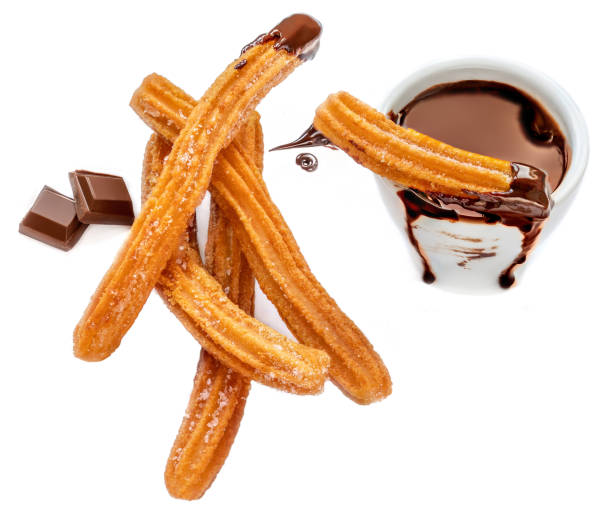 istock Traditional Churros with sugar and chocolate dip isolated on white  background.  Churro - Fried dough pastry 1187285925