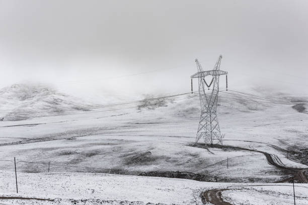 istock electricity pylon on mountain which covered with snow 1187290361
