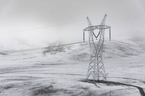 istock electricity pylon on mountain which covered with snow 1187290368