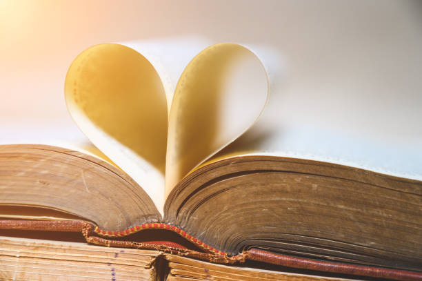 istock An old book with an open heart on a brown paper 1187291516