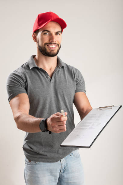 istock Delivery man ask to sign invoice 1187295832