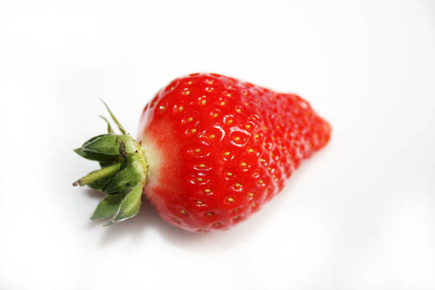 Fresh strawberry isolated on the white plate.