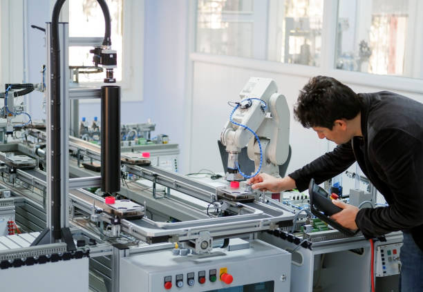 industry 4.0 concept: robot programming stock photo