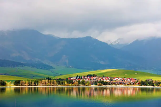 Photo of village on the shore of a lake