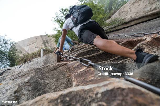 Climber Tackling Steep Stone Stairs On Huashan Mountain Stock Photo - Download Image Now