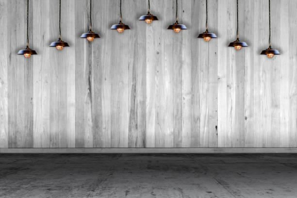 istock Empty room - wooden wall with lamp and laminate flooring. User for background 1187299851