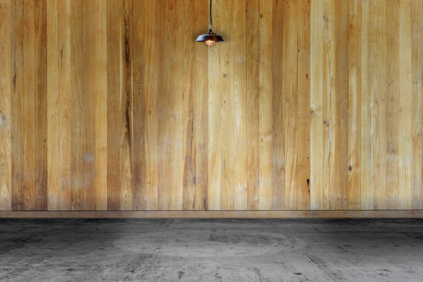 istock Empty room - wooden wall with lamp and laminate flooring. User for background 1187299889