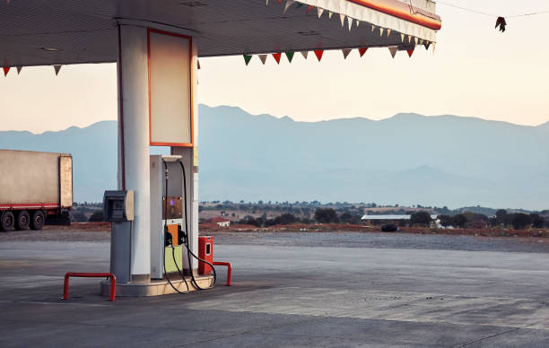 istock Fuel gas station and pump at dawn 1187301078