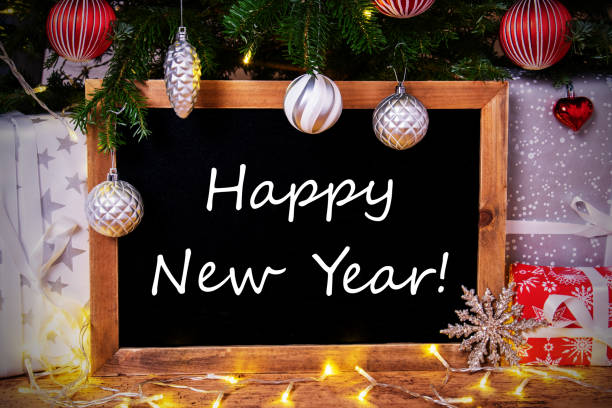 istock Chalkboard, Tree, Gift, Fairy Lights, Text Happy New Year 1187302096