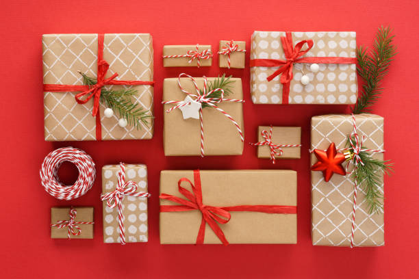 istock Set of Christmas gift boxes and decoration on red background. 1187303014