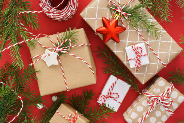 istock Christmas gift boxes, toys and decoration on red background. 1187303072
