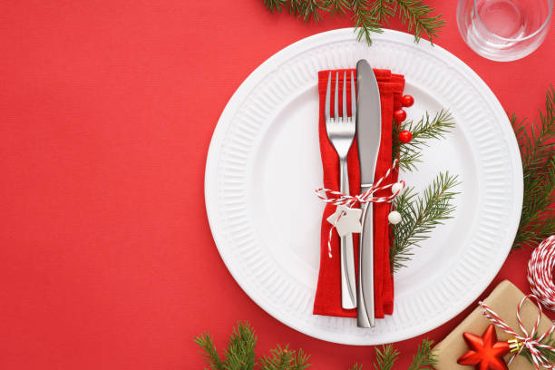 istock Christmas table setting with white plates, napkin and cutlery. 1187303184