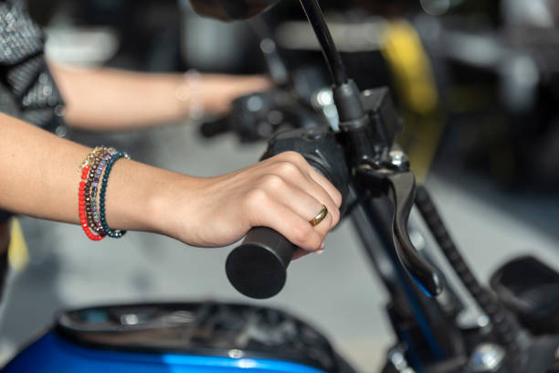young woman is riding a motorcycle