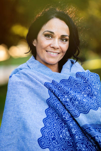 istock Brunette woman in a park 1187309528