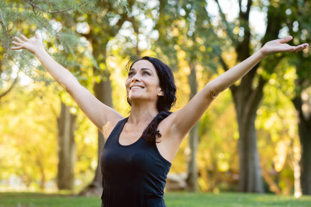 istock Happt brunette woman in a park 1187309536