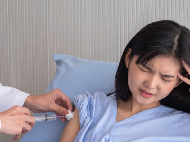 istock woman is having an injection 1187310464