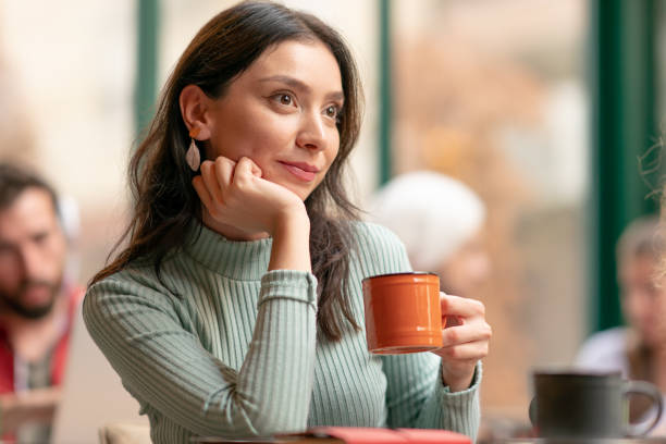 istock Young woman in a coffee shop 1187311017