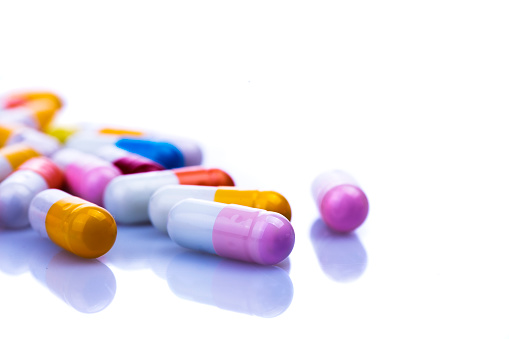 Variety of pills capsules background