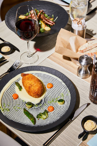 istock chicken kiev with mashed potato served on table with beverages in restaurant 1187317210