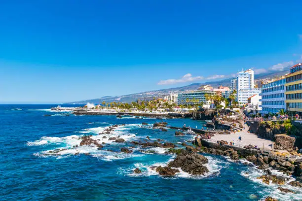 Photo of Puerto de la Cruz Coastline with natural swimming pools and Lago Martianez in the background, Tenerife, Canary Island, Spain