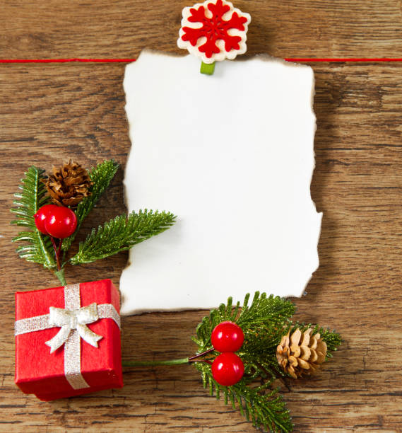 istock blank note with christmas decoration on wooden background 1187321028
