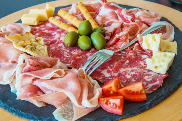 istock delicious starter with mixed salami,ham and cheese 1187322315