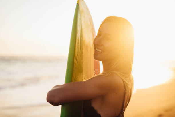istock Woman with surfboard 1187322319