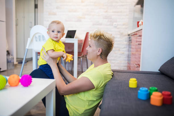 istock Mother playing with her cute baby boy. 1187322339