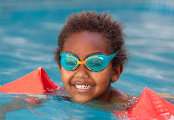 istock Little african child in the pool 1187323734
