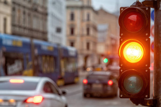 istock A city crossing with a semaphore. Orange light in semaphore - image 1187323950