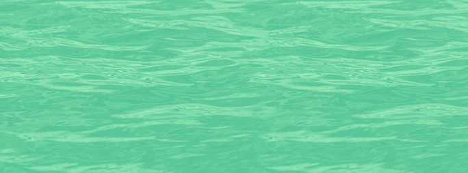 Background green water surface. Aqua blurred texture. Neo Mint Colour. 2020 trend.