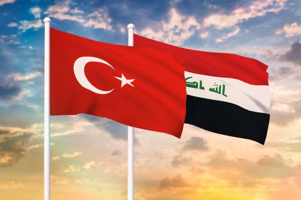 Relationship between the Turkey and the Iraq Relationship between the Turkey and the Iraq. Two flags of countries on heaven with sunset. 3D rendered illustration. iraqi flag stock pictures, royalty-free photos & images