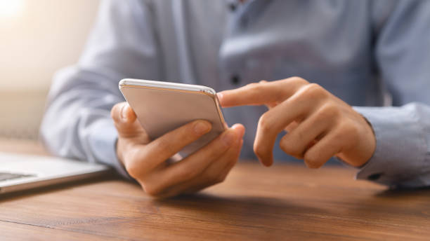 istock Unrecognizable man using smartphone checking his money balance 1187325207