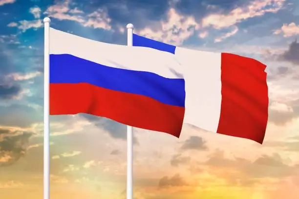 Relationship between the Russia and the France. Two flags of countries on heaven with sunset. 3D rendered illustration.