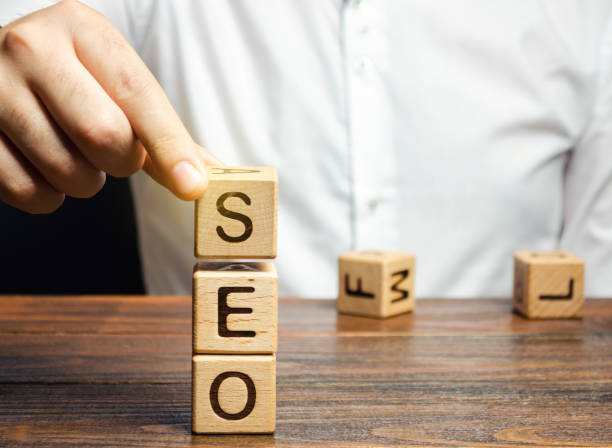istock Blocks with the word SEO and businessman. Search Engine Optimization. Increase the quality and quantity of website traffic by increasing the visibility of a website 1187326778
