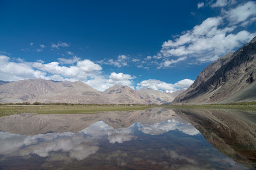 Mountain Reflections, Yarab Tso lake at Panamik near Nubra Valley, Ladakh, India
