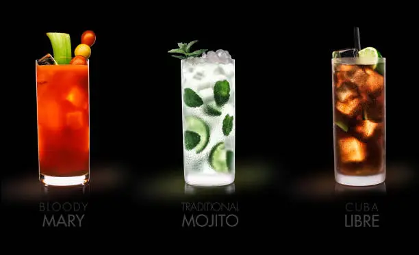 Photo of Famous drinks (Bloody Mary, Mojito, Cuba Libre)  - black background