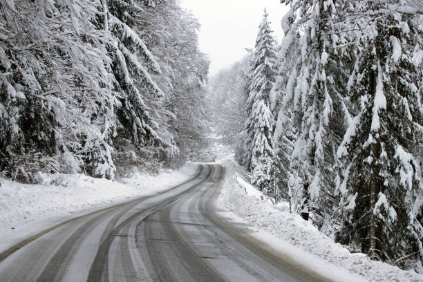 istock Empty road with snow banks on sides. 1187327989