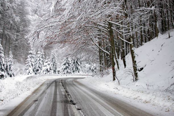 istock Empty road with snow banks on sides. 1187328213