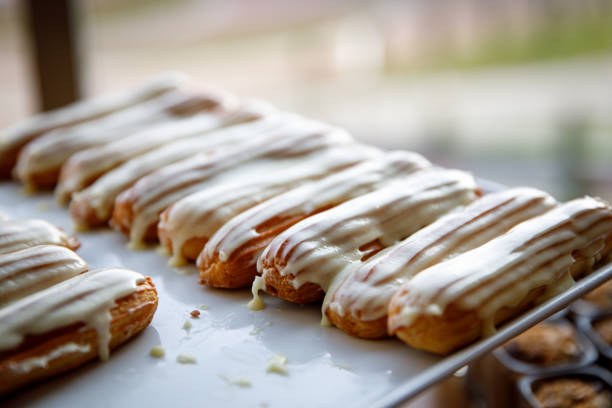 istock White Chocolate Poured Eclairs on catering. 1187328313