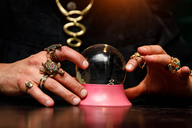 istock Sorcerer uses a crystal ball to predict the future. 1187328377
