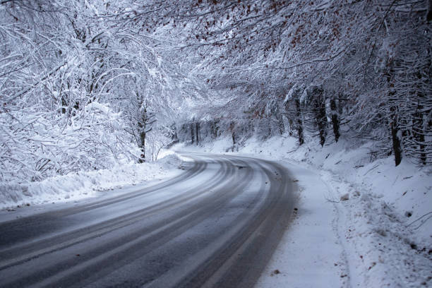 istock Empty road with snow banks on sides. 1187329150