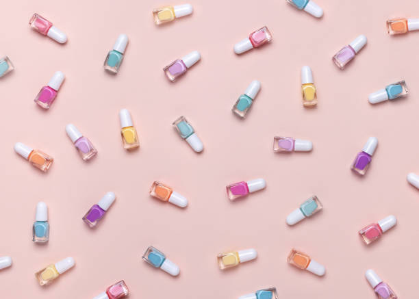 Nail polish pattern. Pastel colors. Pink background. Top view. nail polish stock pictures, royalty-free photos & images