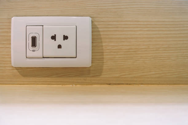 istock Public USB charger and power outlets on wooden table 1187333944