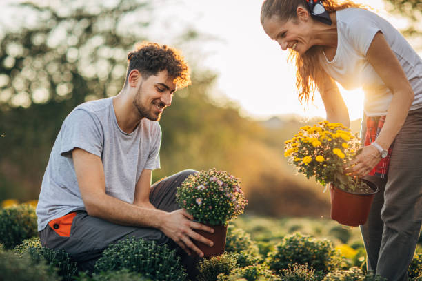istock Man and woman working in garden 1187334037