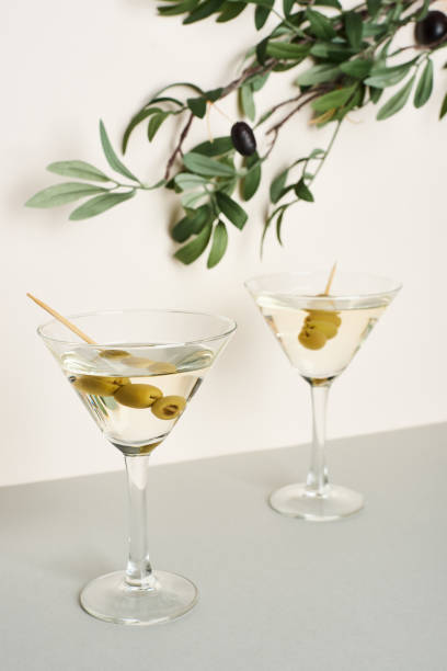 istock Martini cocktails with olive branch isolated on white background 1187335209