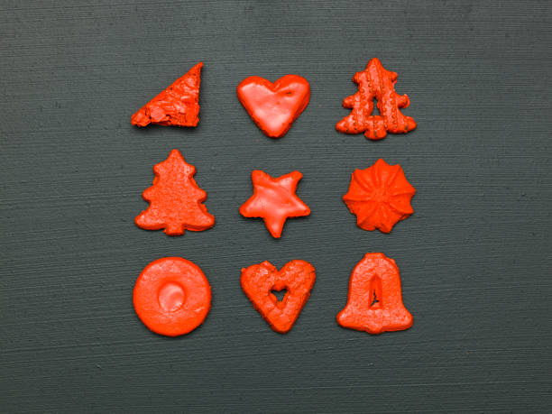 istock red christmas cookies on black background 1187335497